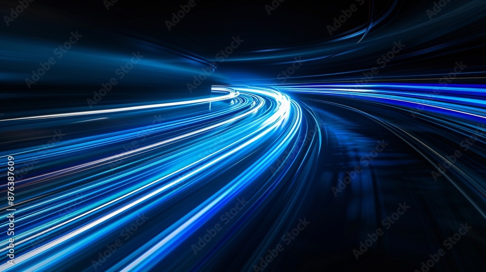 Futuristic Blue Light Trails on Curved Path. A dynamic image of bright blue light trails on a curved path, creating a sense of speed and motion against a dark background. Futuristic Blue Light Trails on Curved Path. A dynamic image of bright blue light trails on a curved path, creating a sense of speed and motion against a dark background.