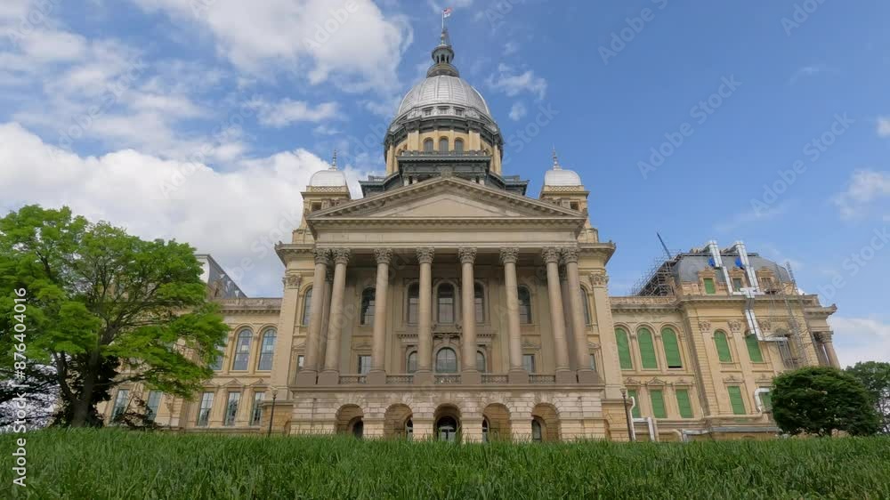 Views of the front facade of the Illinois State Capitol Building. Scaffolding and construction equipment with ongoing construction at the building. Views of the front facade of the Illinois State Capitol Building. Scaffolding and construction equipment with ongoing construction at the building.