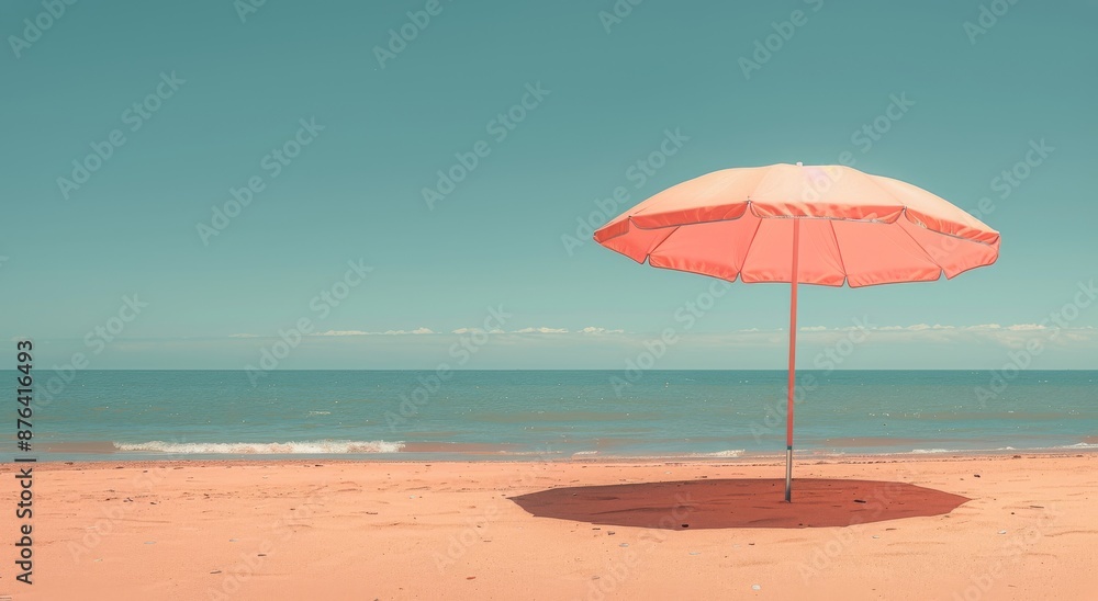 A Single Orange Beach Umbrella Stands Alone on a Sandy Shore A Single Orange Beach Umbrella Stands Alone on a Sandy Shore