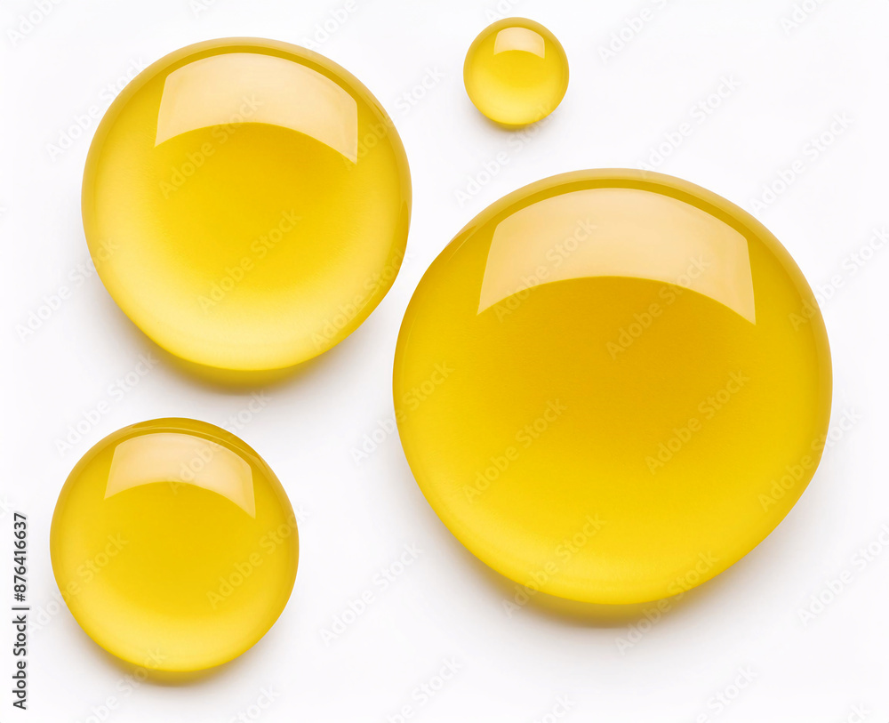A collection of yellow circle liquid droplets with a white background A collection of yellow circle liquid droplets with a white background
