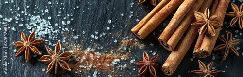 Close Up of Cinnamon Sticks and Star Anise on Black Surface With Golden Glitter