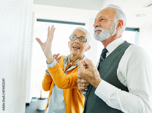 business meeting businesswoman woman elderly senior office presentation whiteboard businessman man teamwork colleague seminar businessperson mature gray hair discussion