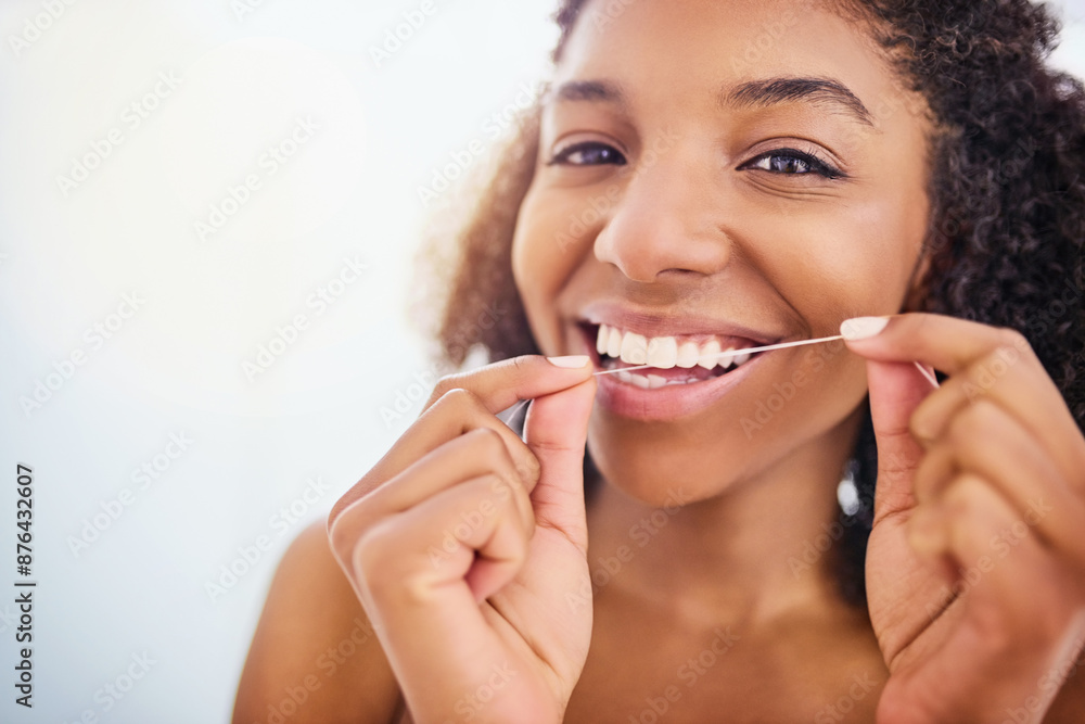 African woman, portrait and floss teeth for dental care, wellness and morning routine in bathroom. Face, happy person and cleaning tooth with string or threat for oral health and hygiene in home African woman, portrait and floss teeth for dental care, wellness and morning routine in bathroom. Face, happy person and cleaning tooth with string or threat for oral health and hygiene in home