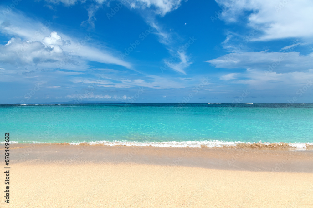 Tropical landscape. Coast. Nusa dua beach, Bali island, Indonesia. Horizon from the shore. Beautiful summertime view ocean on the white sand beach. Tropical landscape. Coast. Nusa dua beach, Bali island, Indonesia. Horizon from the shore. Beautiful summertime view ocean on the white sand beach.