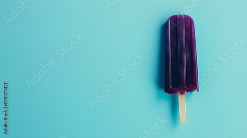 Dark Purple Popsicle on a summery blue Background with Copy Space © drdigitaldesign
