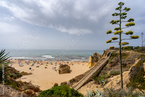 Sandy beach, Mediterranean sea water on a summer day in the town of Armacao de Pera photo