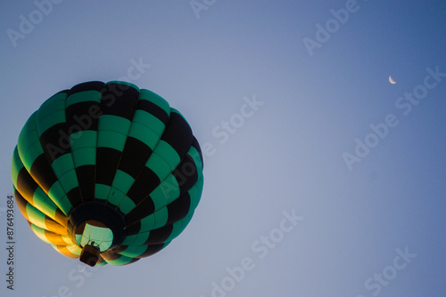 Green Checked Airborne Hot Air Balloon In Flight, Crescent Moon In Sky