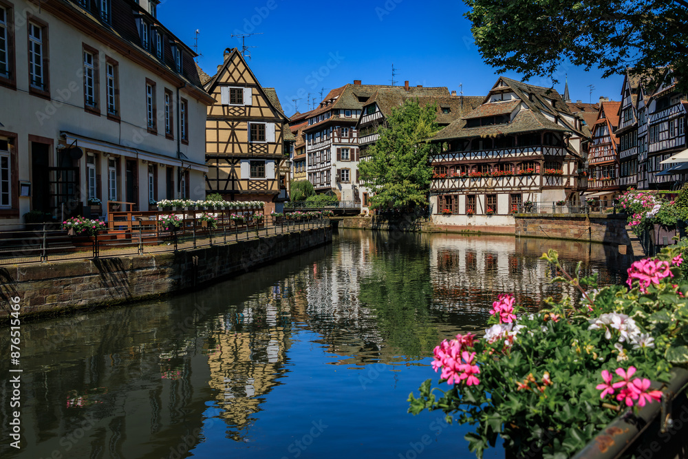Ornate traditional half timbered houses with blooming flowers along the canals in the picturesque Petite France district of Strasbourg, Alsace, France Ornate traditional half timbered houses with blooming flowers along the canals in the picturesque Petite France district of Strasbourg, Alsace, France