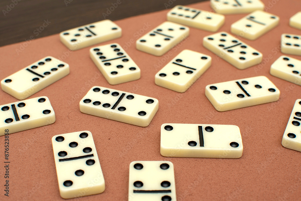 Dominoes bones on brown background Dominoes bones on brown background