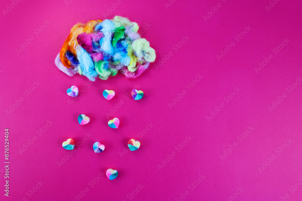 Rain of hearts falling from a multicolored cloud