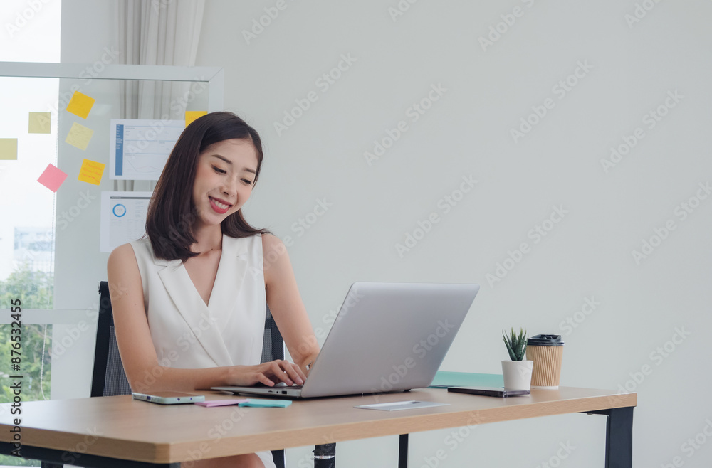 Manager employee woman girl asian one person smile happy enjoy sitting chair on desk looking hand holding notebook laptop ready for business working job online sale inside the room office company Manager employee woman girl asian one person smile happy enjoy sitting chair on desk looking hand holding notebook laptop ready for business working job online sale inside the room office company