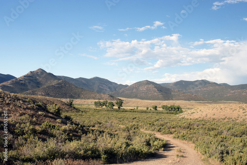 Wildlife Drive and mountains at dawn in Browns Park National Wildlife Refuge in Colorado photo