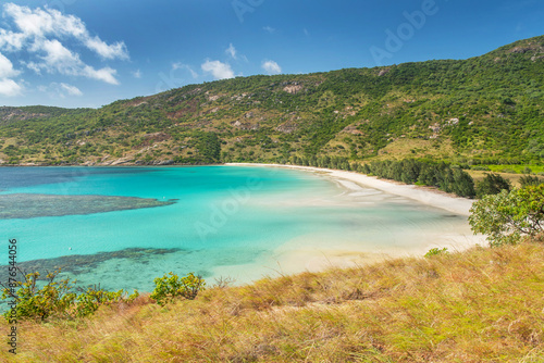 Picturesque tropical sandy Watsons Beach with turquoise water on Lizard Island, Australia. Lizard Island  is located on Great Barrier Reef in north-east part of Queensland