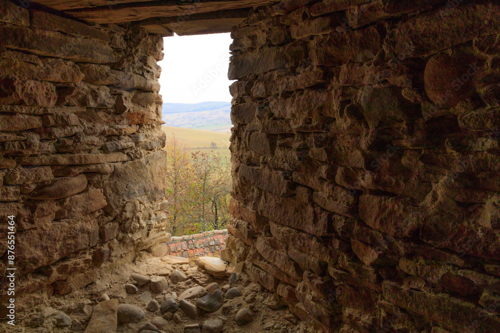 Fototapeta premium Europe, Romania. Viscri. View from stone window in Fortified Church.