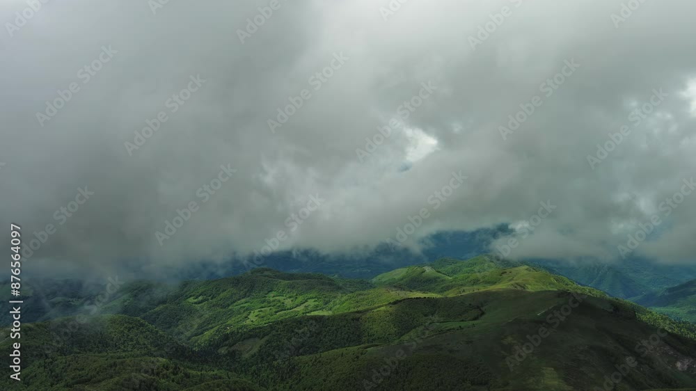 Aerial view of clouds over summer green mountains landscape, 4k Aerial view of clouds over summer green mountains landscape, 4k