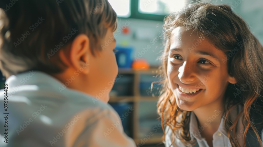 This image showcases a young teacher warmly interacting with a smiling student in a classroom setting, capturing the essence of building positive educational relationships. This image showcases a young teacher warmly interacting with a smiling student in a classroom setting, capturing the essence of building positive educational relationships.