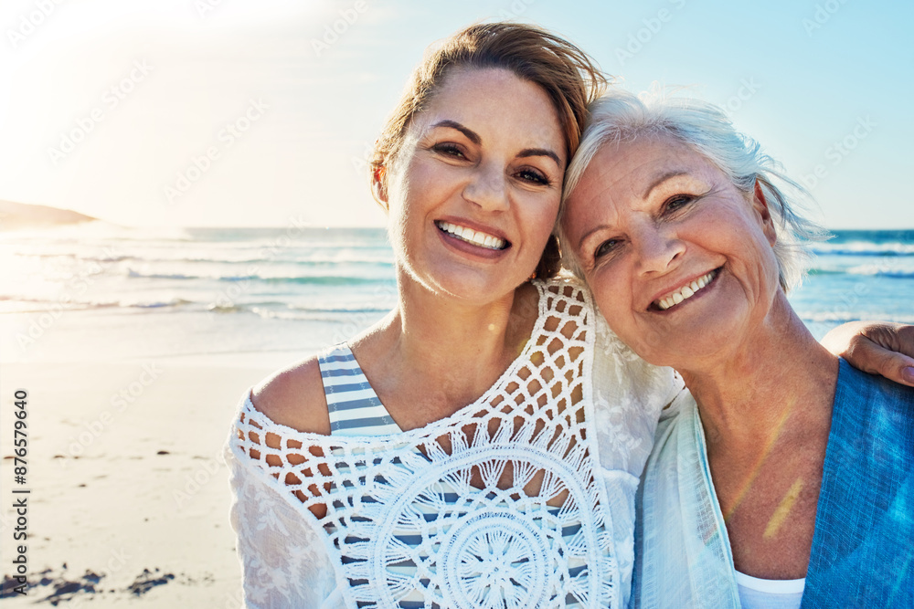 Beach, portrait and woman with senior mother for travel, vacation or weekend trip in summer. Happy, love and person with elderly mom by ocean or sea for bonding on tropical holiday for retirement. Beach, portrait and woman with senior mother for travel, vacation or weekend trip in summer. Happy, love and person with elderly mom by ocean or sea for bonding on tropical holiday for retirement.