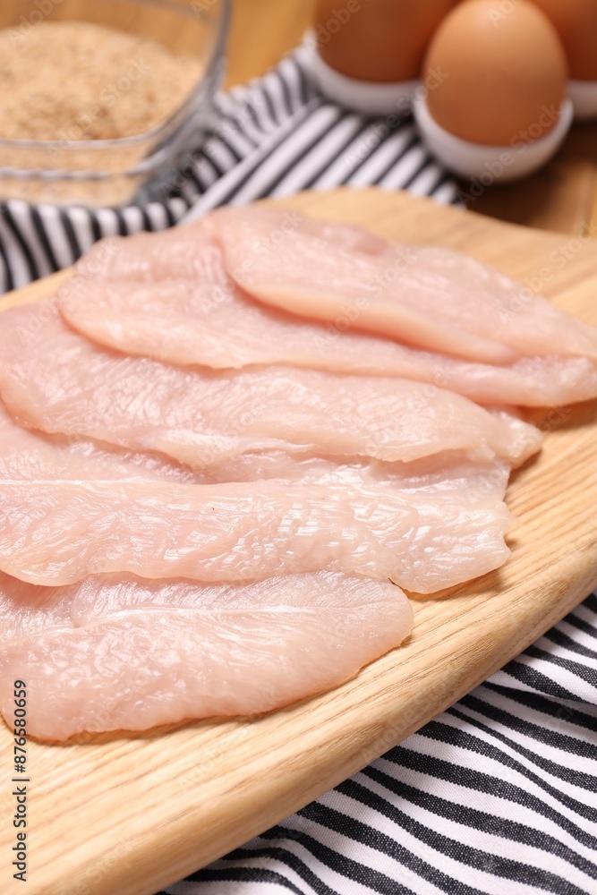 Cooking schnitzel. Raw meat, eggs and breadcrumbs on table, closeup Cooking schnitzel. Raw meat, eggs and breadcrumbs on table, closeup