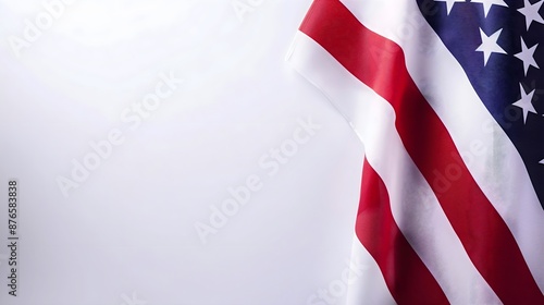 A red, white and blue American flag with stars. The flag is waving in the wind.