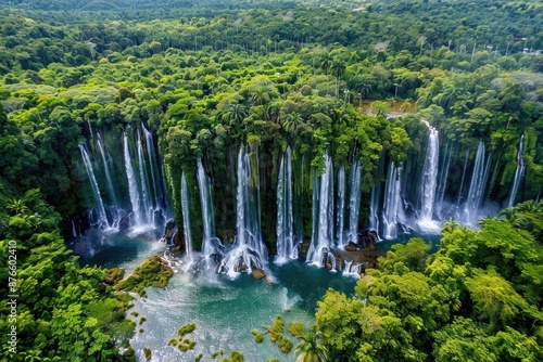 Aerial View of a Waterfall in a Lush Green Forest