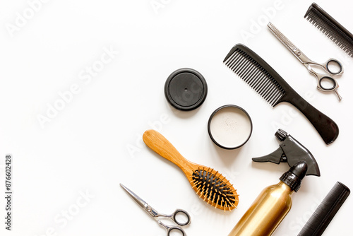 combs and hairdresser tools on white background top view