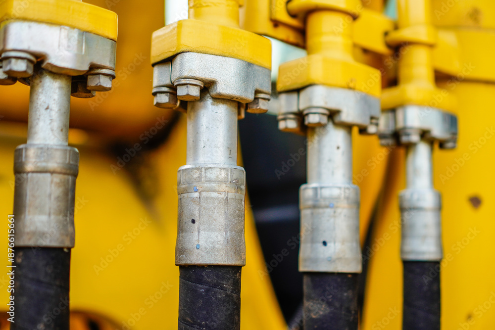 close-up view of nozzle hose attached with reinforcing bolts.hydraulics pipes and nozzles, tractors or other construction equipment. close-up view of nozzle hose attached with reinforcing bolts.hydraulics pipes and nozzles, tractors or other construction equipment.