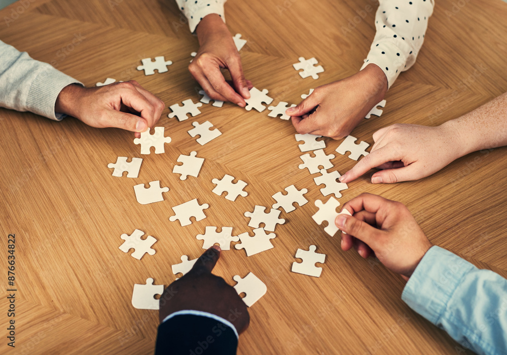 Business hands, planning and puzzle piece for group problem solving, strategy or workflow process on table. People in circle with creative game for cross departmental collaboration, ideas or solution Business hands, planning and puzzle piece for group problem solving, strategy or workflow process on table. People in circle with creative game for cross departmental collaboration, ideas or solution