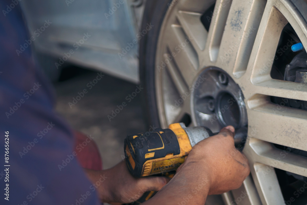 Mechanic man hands checking car tires outdoor on site service auto garage for automotive mobile center services. Technician workshop repair checking tyres car motor vehicles service mechanical hands Mechanic man hands checking car tires outdoor on site service auto garage for automotive mobile center services. Technician workshop repair checking tyres car motor vehicles service mechanical hands