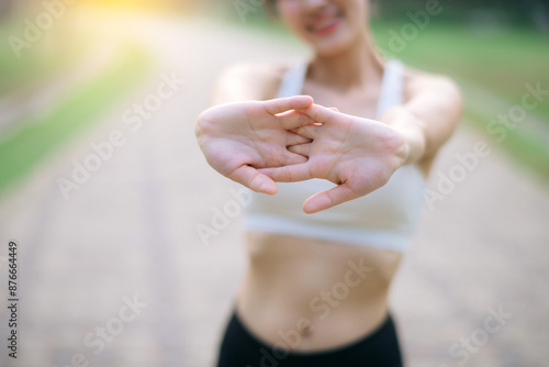 Wallpaper Mural Sportswoman. Fit young Asian woman with sportswear stretching muscle in park before running and enjoying healthy outdoor. Fitness runner girl in public park. Wellness being concept Torontodigital.ca
