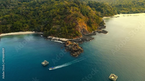 Cinematic 4K drone footage of Kunti Island at Ciletuh Geopark during sunset, showcasing breathtaking landscapes, vibrant colors, and serene natural beauty from a bird's-eye view. photo