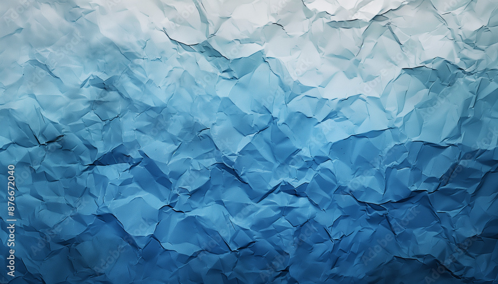 Obraz premium Crumpled paper texture with shades of blue, creating an abstract background