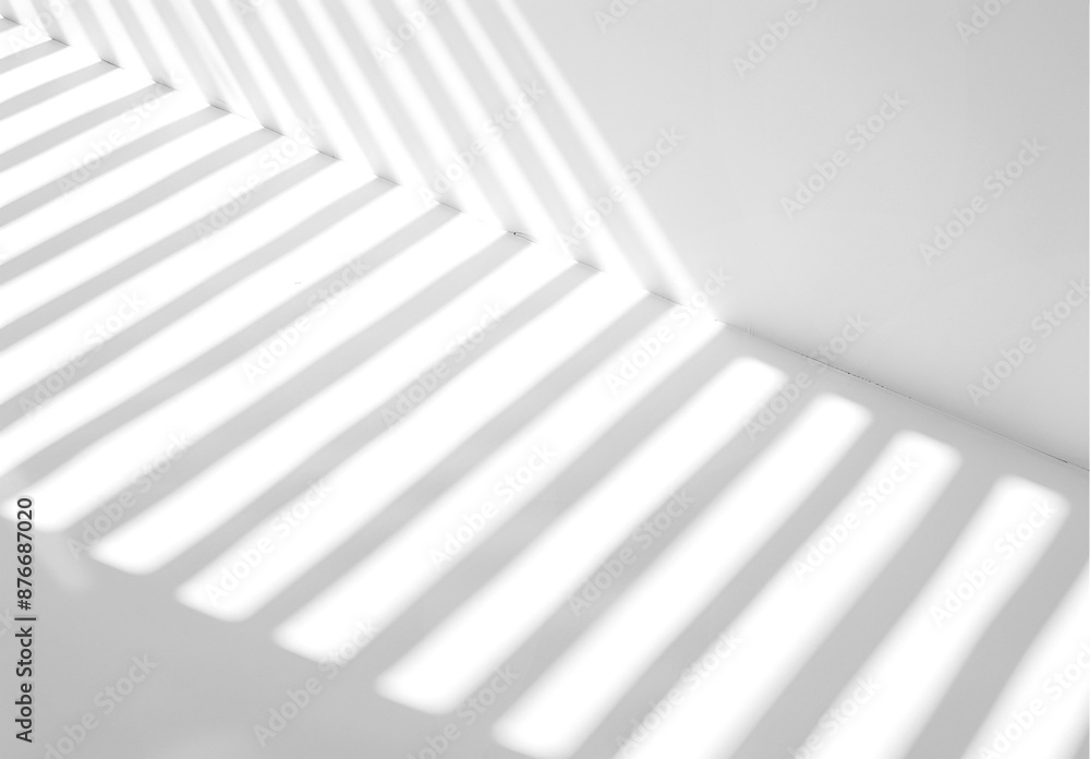 Empty white wall where sunlight shining through a window Empty white wall where sunlight shining through a window