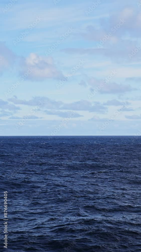 Open Ocean and Sea Background with Horizon and Blue Sky, Gentle Rolling Waves and Swell in Vast Expanse of Endless Water, Vertical Video for Social Media, Instagram Reels and Tiktok Open Ocean and Sea Background with Horizon and Blue Sky, Gentle Rolling Waves and Swell in Vast Expanse of Endless Water, Vertical Video for Social Media, Instagram Reels and Tiktok