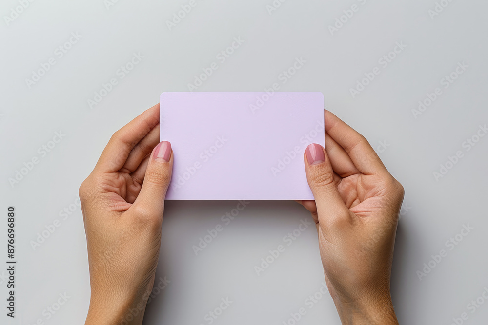 Holding blank paper in both hands Holding blank paper in both hands
