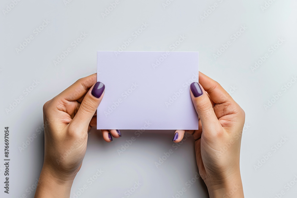 Holding blank paper in both hands Holding blank paper in both hands