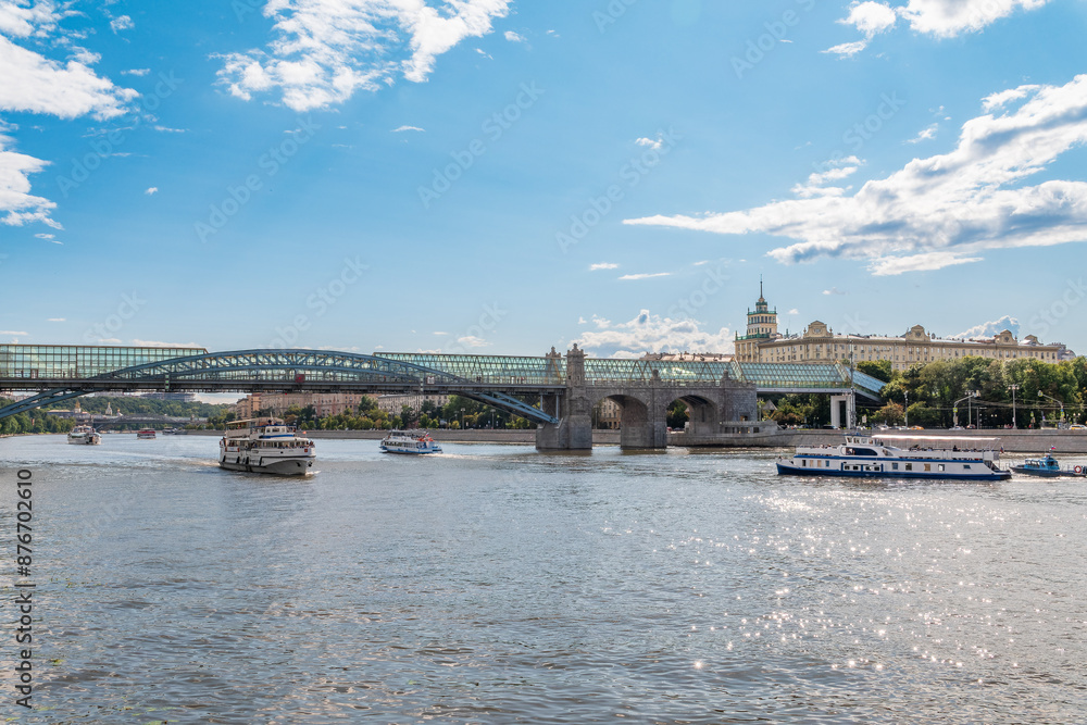 Fototapeta premium View of the Moscow river embakment, Pushkinsky bridge and cruise ships at sunset.