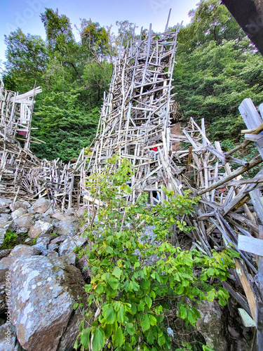 nimis wooden artwork structures at Ladonia Micro Nation near Kullaberg, Sweden as a wood contruction made from driftwood on the beach photo