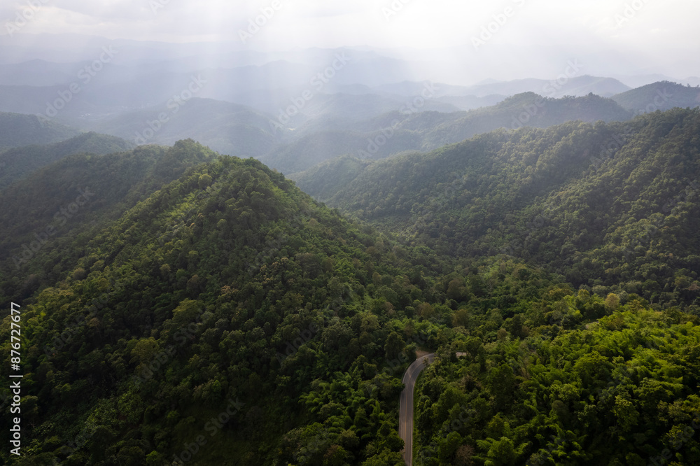 Obraz premium Landscape of Morning Mist with Mountain Layer at north of Thailand. mountain ridge and clouds in rural jungle bush forest