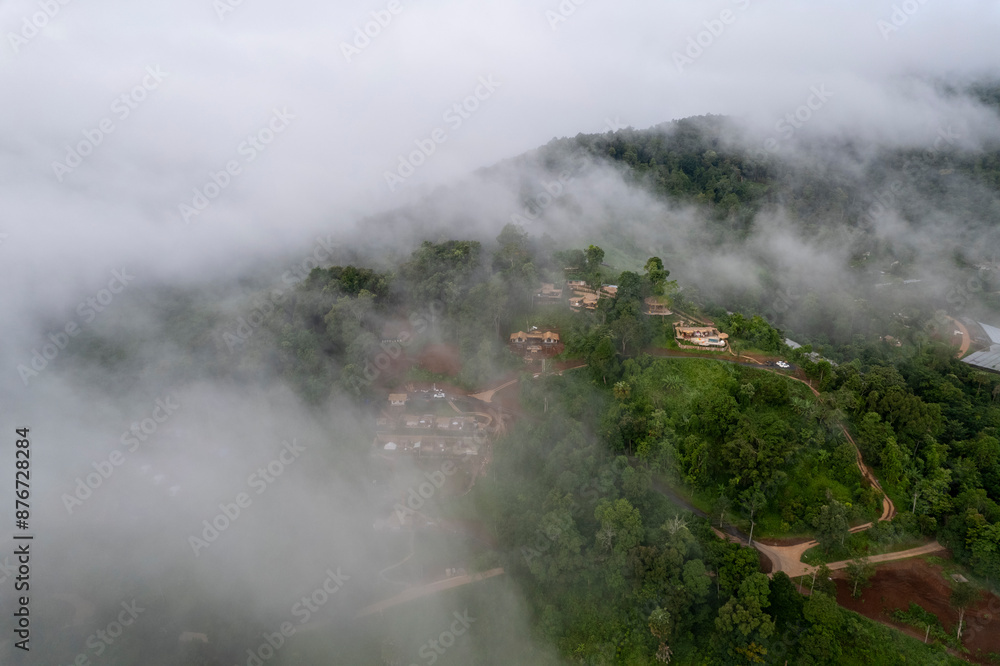 Landscape of Morning Mist with Mountain Layer at north of Thailand. mountain ridge and clouds in rural jungle bush forest