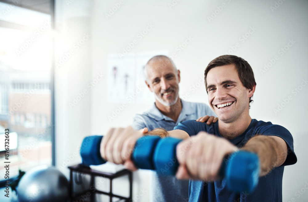 Man, physiotherapy and dumbbell for arm exercise, physiotherapist and clinic for sport injury recovery. Body wellness, mobility support and client or muscle strength, medical help and assessment Man, physiotherapy and dumbbell for arm exercise, physiotherapist and clinic for sport injury recovery. Body wellness, mobility support and client or muscle strength, medical help and assessment
