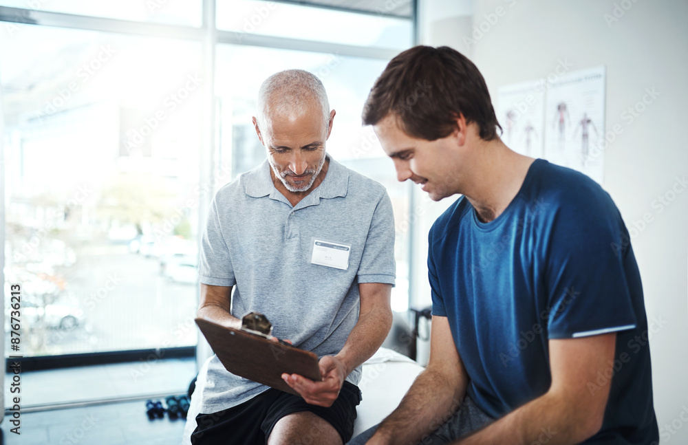 Obraz premium Men, physiotherapist and happy with patient for rehabilitation with clipboard in smile for checklist, results and report. People, and healthcare clinic on fitness, exercise and training for wellness