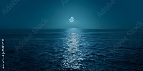 Expansive moonlit ocean view with a deep blue horizon. Concept Ocean Views, Moonlit Scenery, Deep Blue Horizon, Expansive Landscape photo