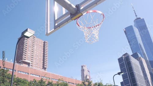 New York City World Trade Center skyscraper tower building, Manhattan Downtown Financial district, USA. Hudson River Park basketball court. Basket ball hoop and blackboard. Outdoor streetball sport.