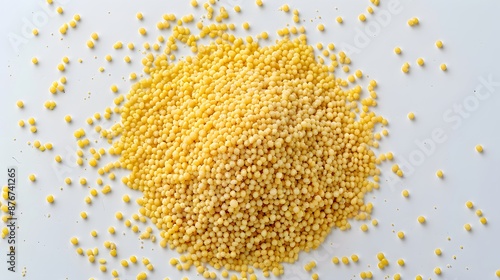 Couscous grains on a white background, isolated, top view, healthy eating.