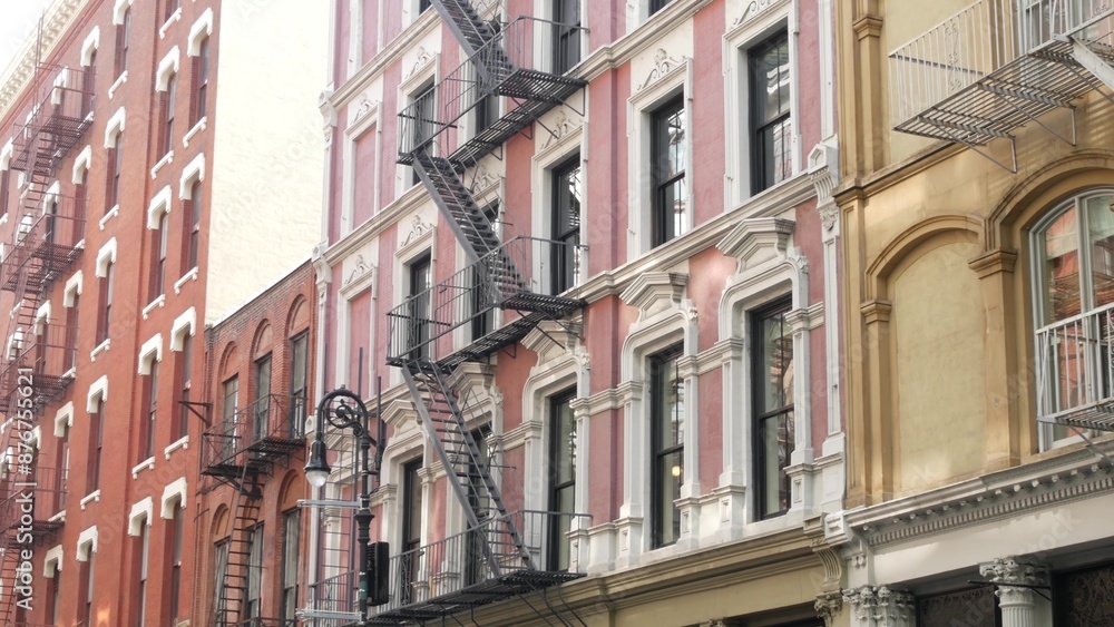 Fototapeta premium New York City Manhattan Soho fashion district near Broadway street. USA urban building facade, old classic american architecture. Shopping in NYC, United States. Business and residential real estate.