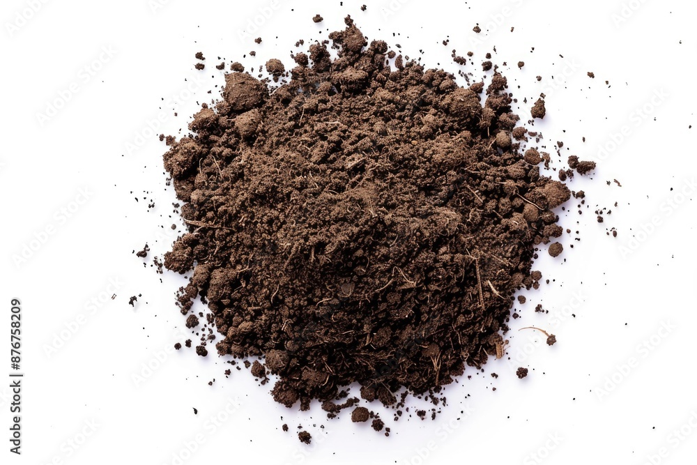 A pile of dirt on a white surface A pile of dirt on a white surface