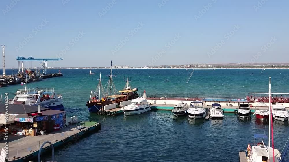 Pier with moored boats, overlooking the sea. Pier with moored boats, overlooking the sea.