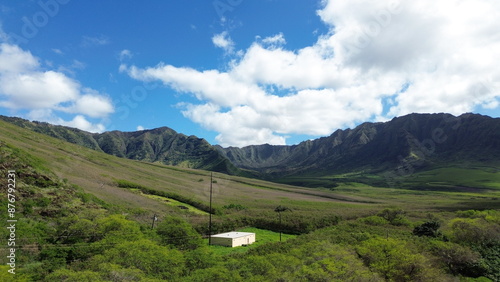 Hawaii Beautiful Coastal Landscape with Green Mountains and a Sandy Beach by Clear Blue Waters