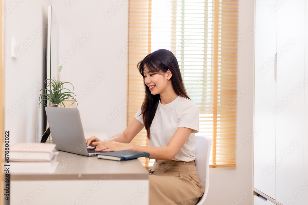Woman meeting online on her laptop and smartphone at home Woman meeting online on her laptop and smartphone at home