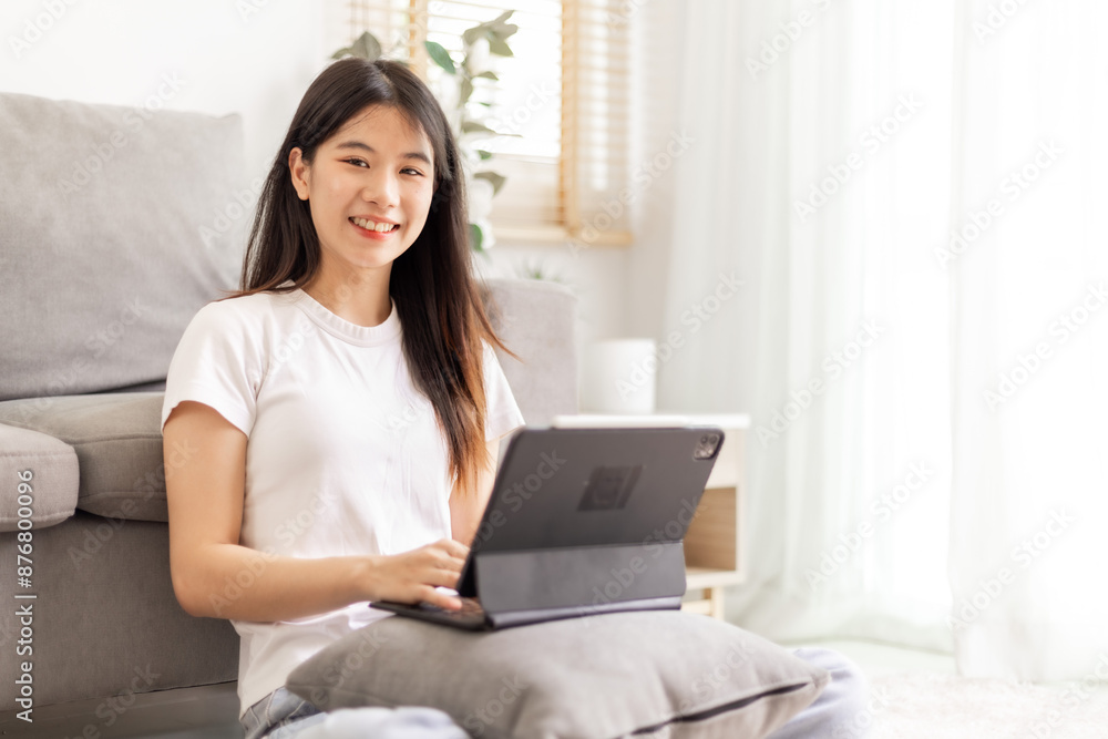 Woman meeting online on her laptop and smartphone at home Woman meeting online on her laptop and smartphone at home
